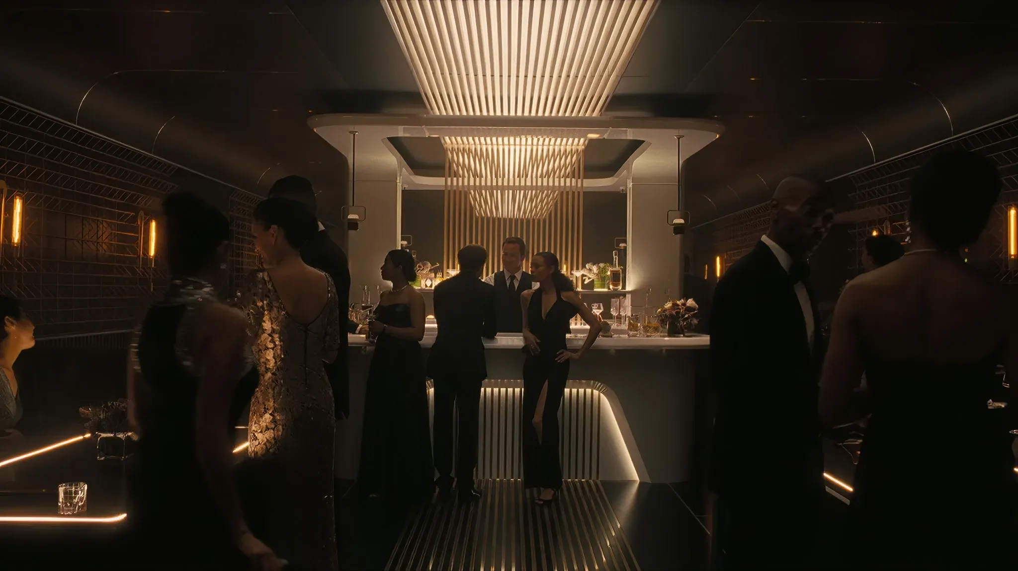 A group of people standing in a dark room.